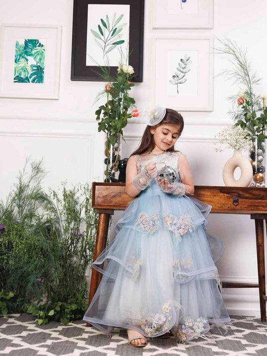 Daphne blue and white layered gown with flowers and feathers detailing