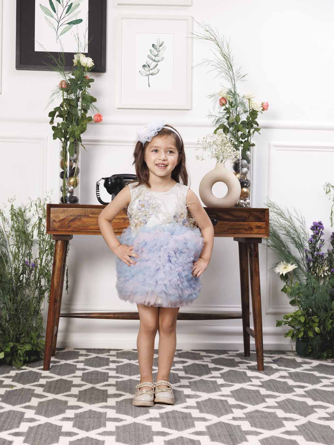 Aida ruffled pink and blue dress with flower and feathers detailing