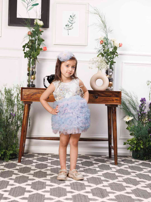 Aida ruffled pink and blue dress with flower and feathers detailing