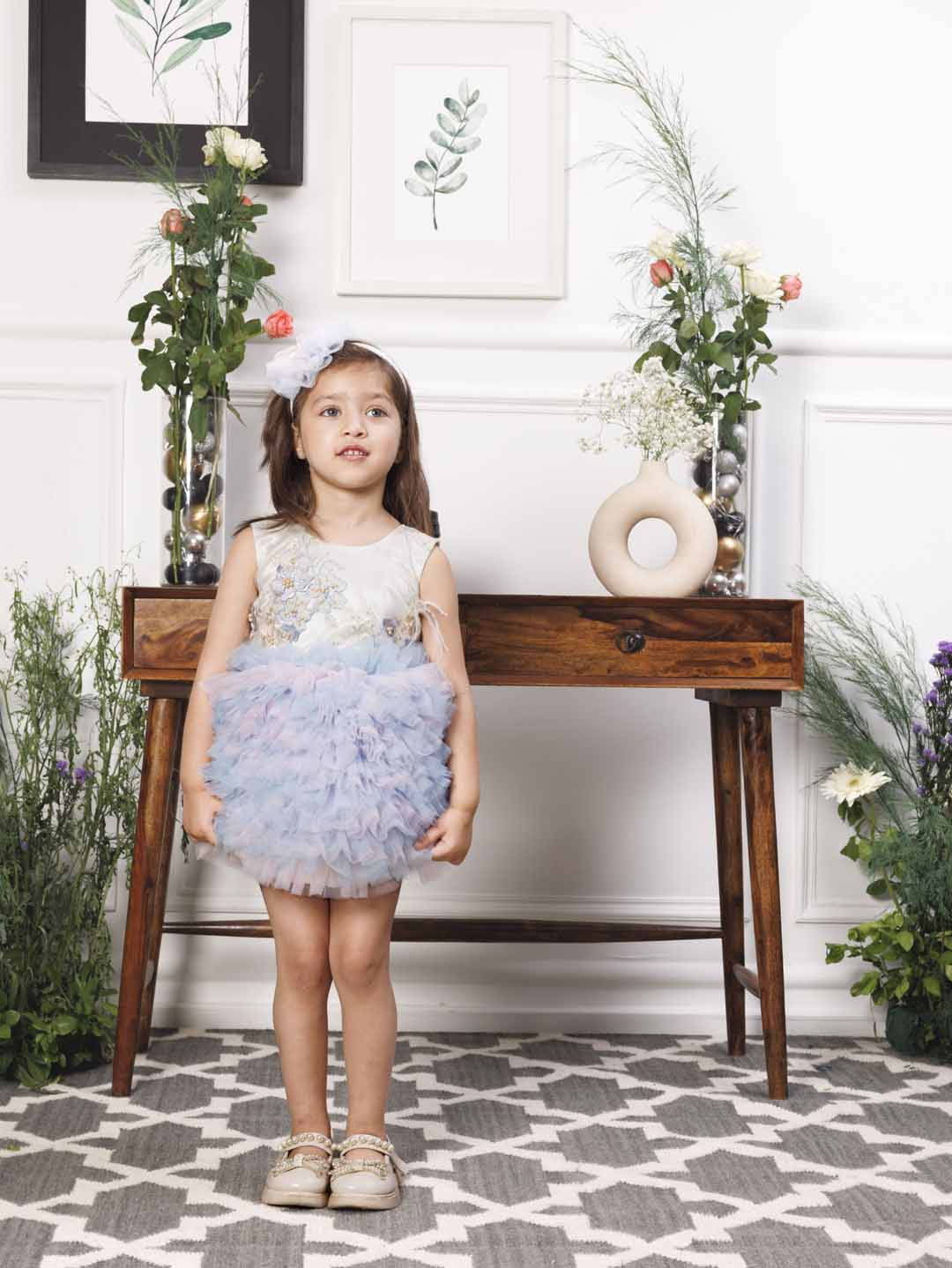 Aida ruffled pink and blue dress with flower and feathers detailing