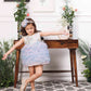 Aida ruffled pink and blue dress with flower and feathers detailing