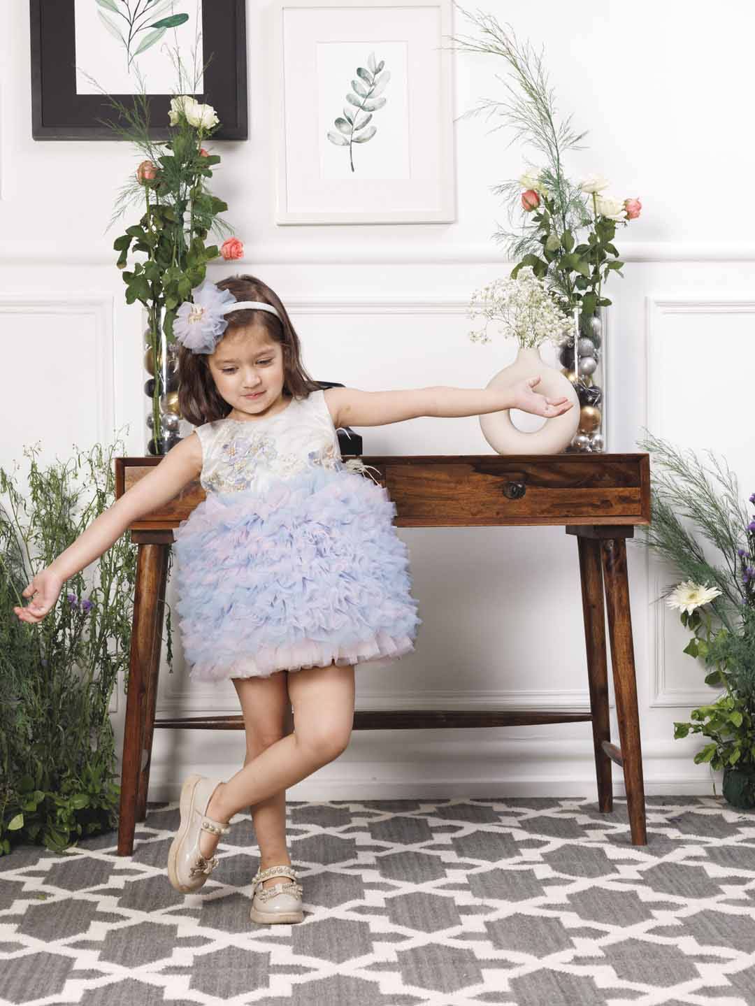 Aida ruffled pink and blue dress with flower and feathers detailing