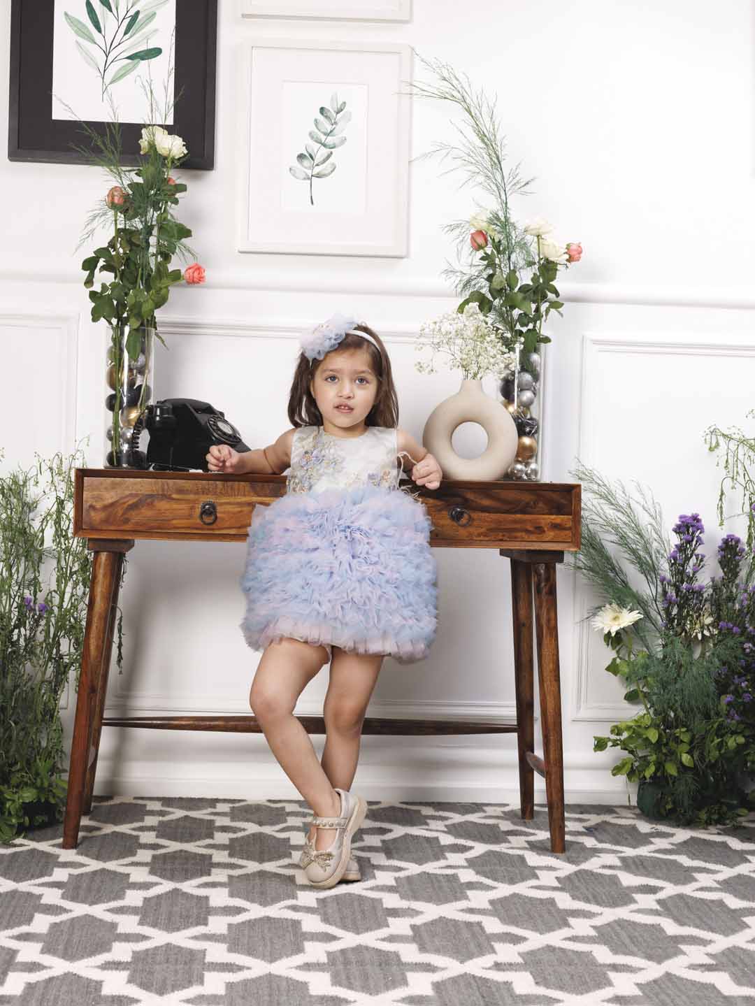 Aida ruffled pink and blue dress with flower and feathers detailing