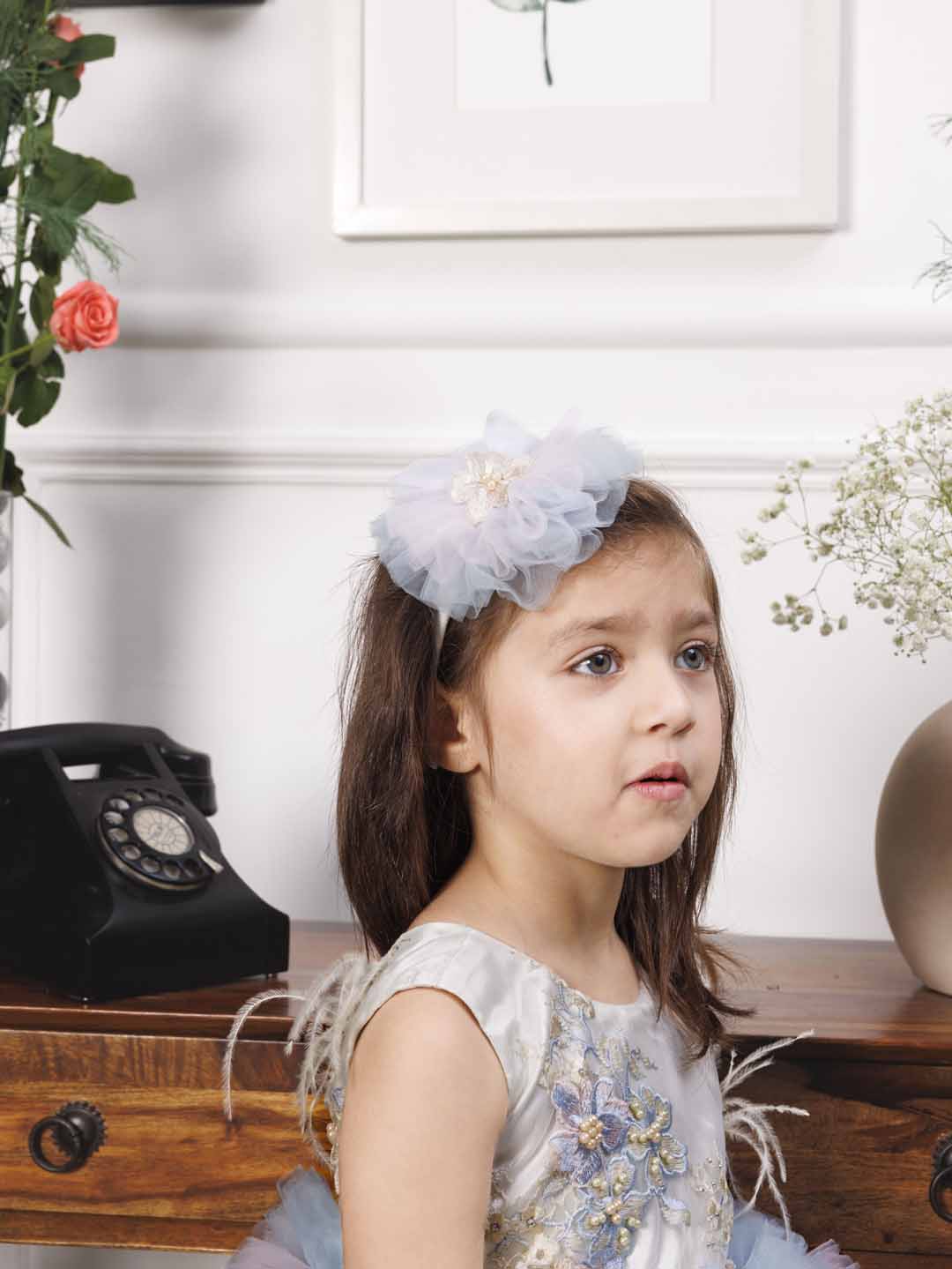 Aida ruffled pink and blue dress with flower and feathers detailing