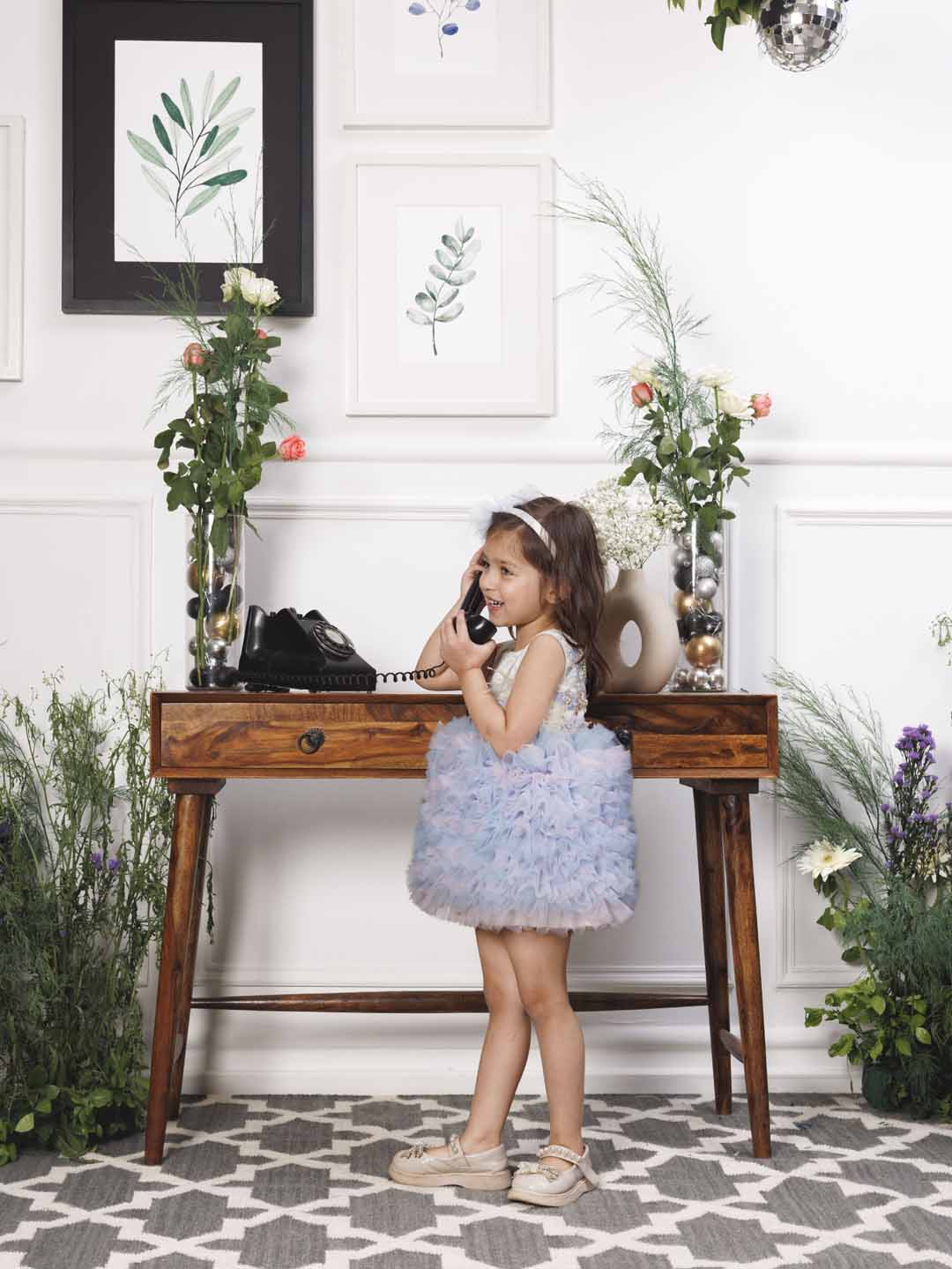 Aida ruffled pink and blue dress with flower and feathers detailing