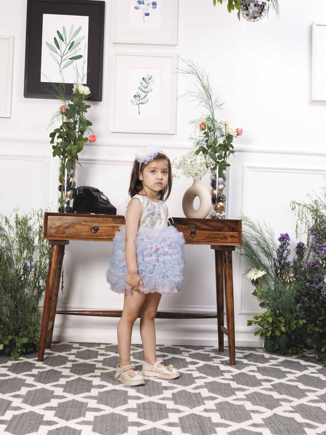 Aida ruffled pink and blue dress with flower and feathers detailing