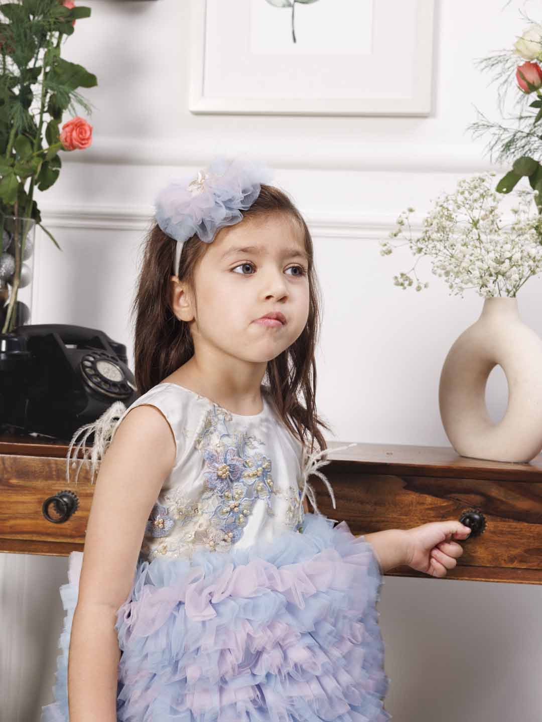 Aida ruffled pink and blue dress with flower and feathers detailing