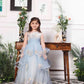 Daphne blue and white layered gown with flowers and feathers detailing