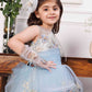 Daphne blue and white layered gown with flowers and feathers detailing