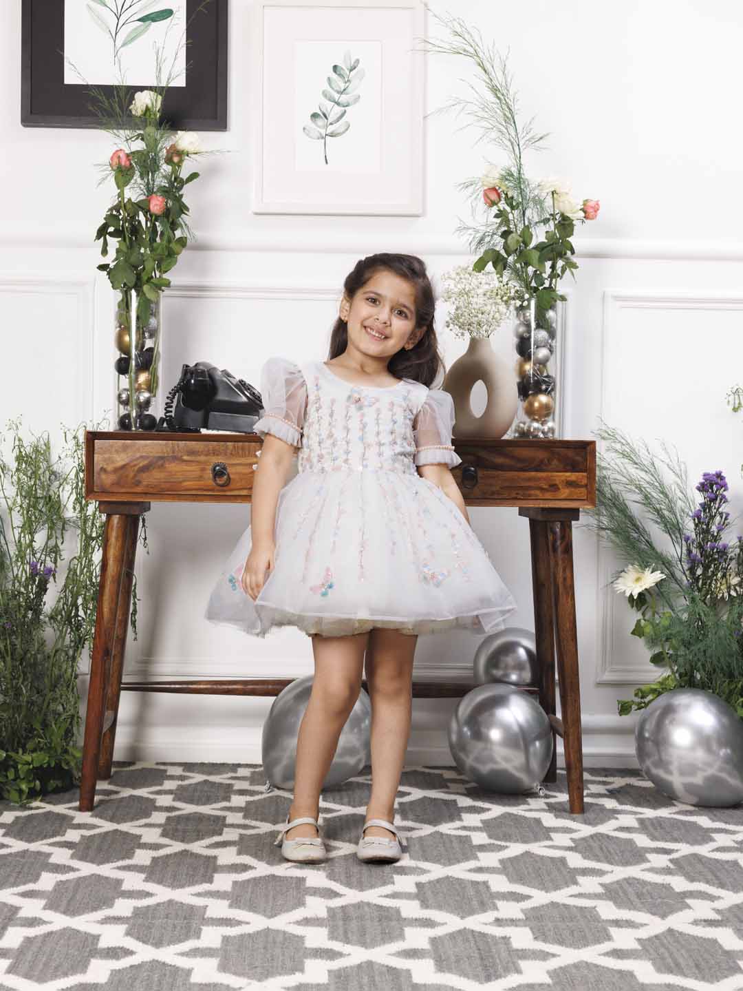 Phillipa white organza dress with hand embroidery of flower and butterflies detailing