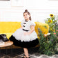 Risa the magical ruffled dress in black and white