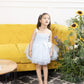 Mia blue fluffy skirt and gathered bodice with pearls and flowers detailing